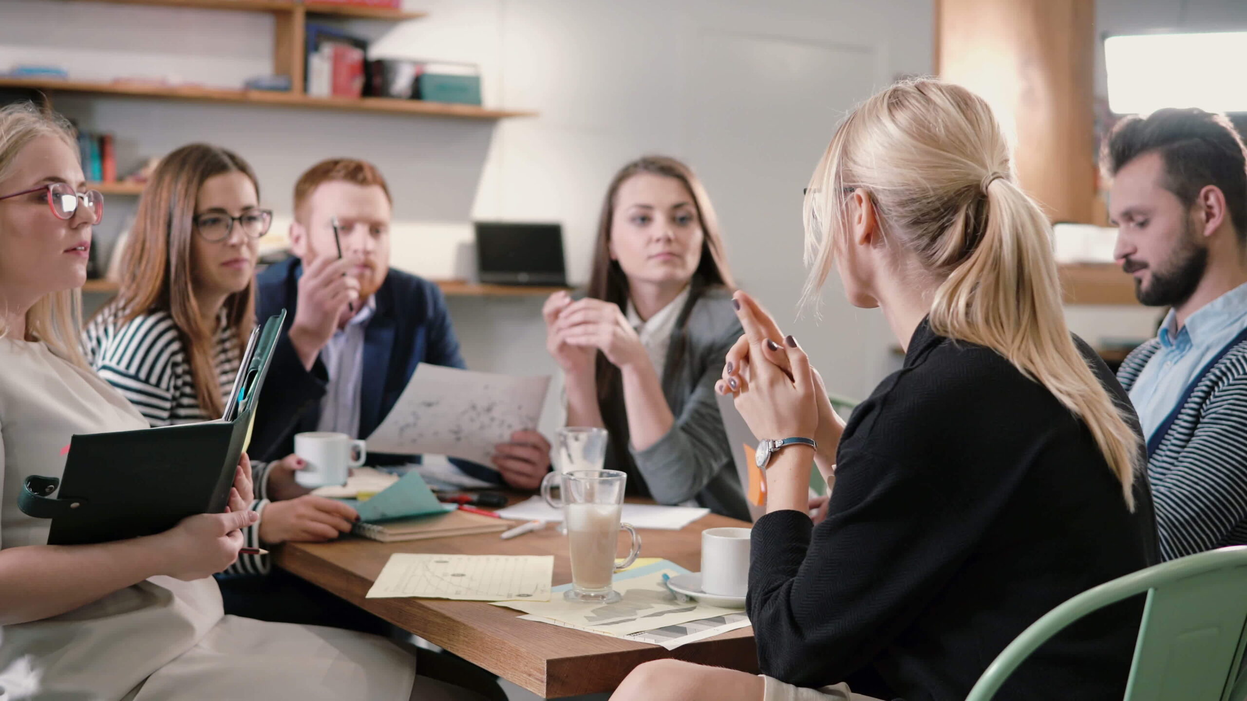 Creative,Business,Team,At,Table,In,A,Modern,Startup,Office.